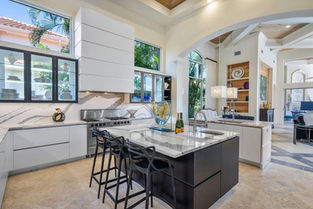 Custom kitchen island in walnut, Palm Beach County residence, Jupiter FL