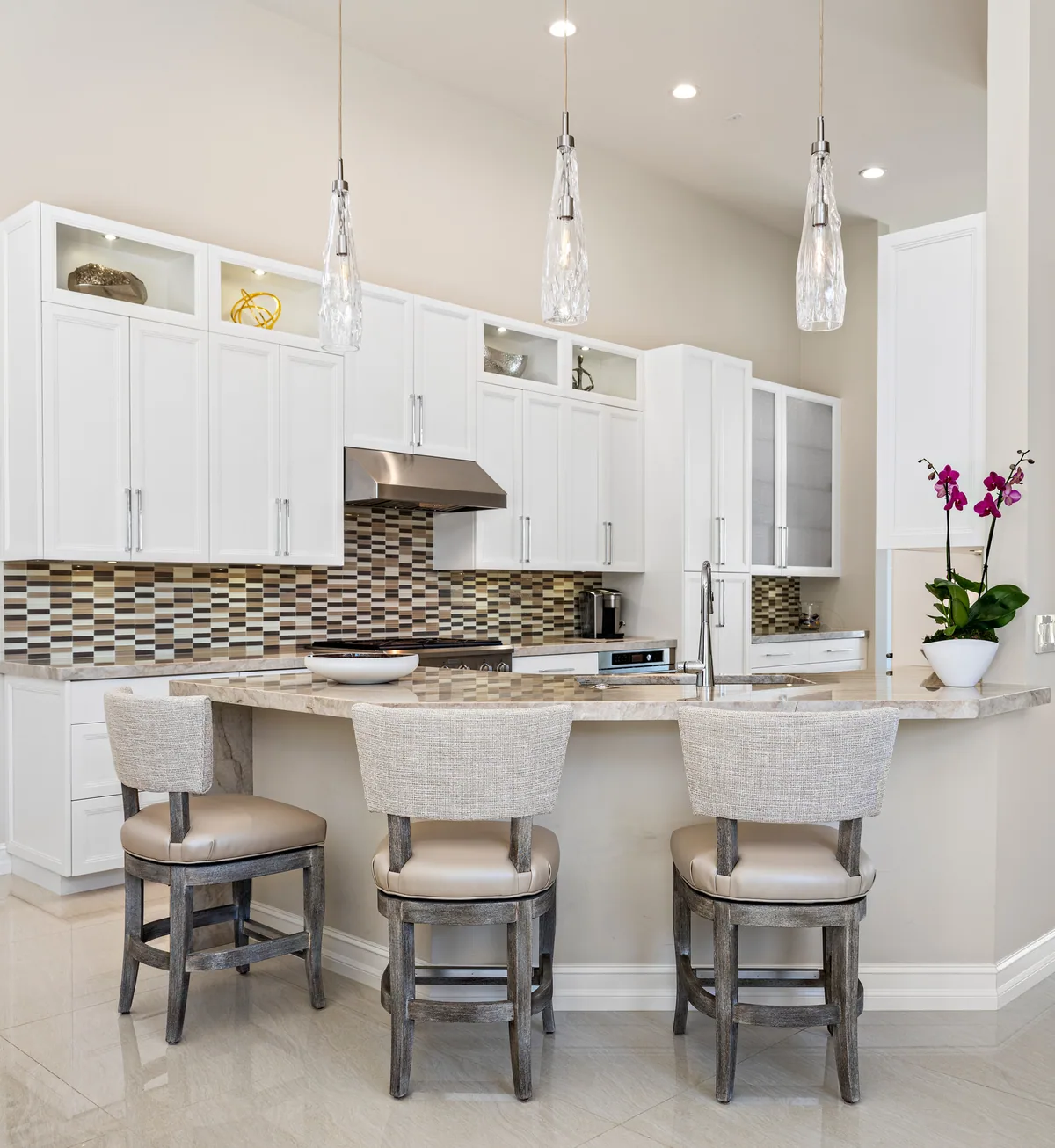 Custom white painted kitchen with glass-front upper cabinets