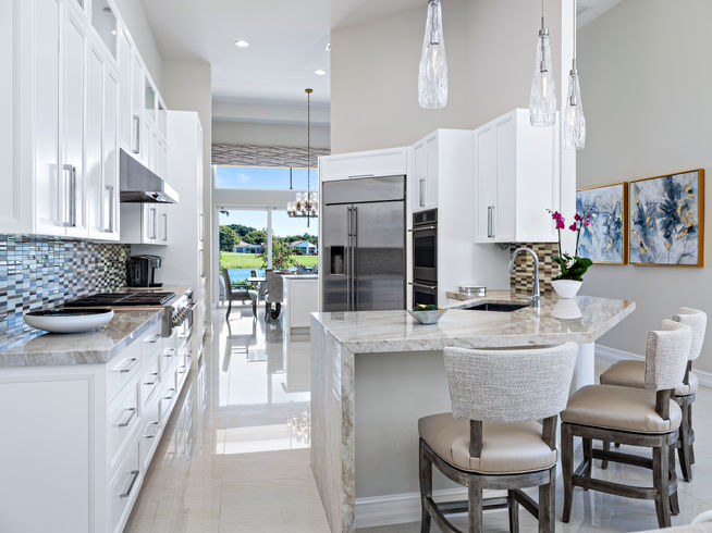 Custom kitchen cabinetry with stone counters