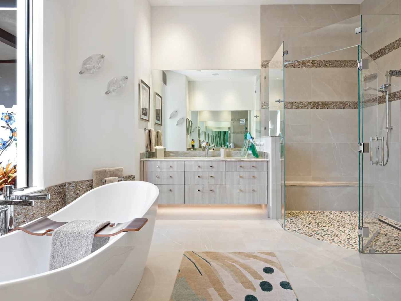 Custom primary bath with a cerused oak vanity, freestanding tub and glass walk-in shower, Palm Beach County residence, Jupiter FL