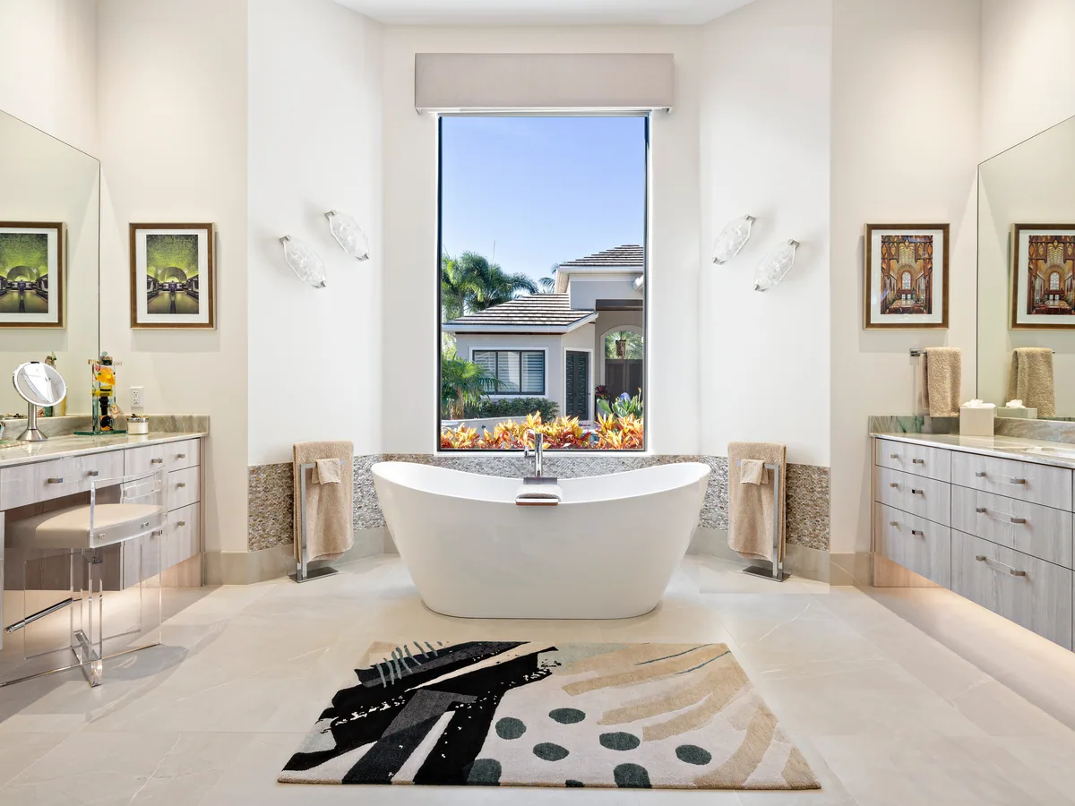 Custom primary bath with facing dual vanities